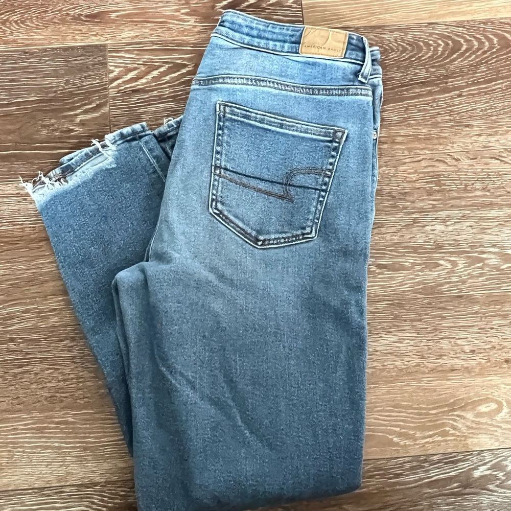 AE stretch mom Jean with distressing in knees. Medium wash